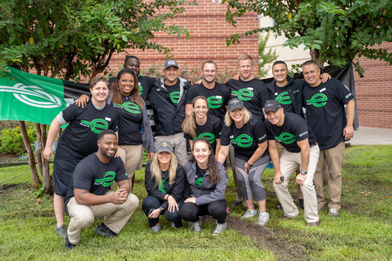 Enterprise employees gathered for a group photo during a planting event in Belaire, Texas